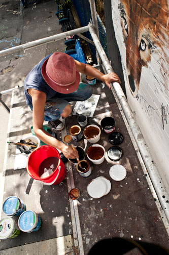 mixing colour pots of paint